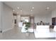 Open concept view of the living room shows the tile floors and the connection to the kitchen and dining areas at 13333 Oakenshaw Ln, Orlando, FL 32832