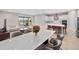 Open-concept living space with views of the kitchen and dining area, ideal for entertaining at 13333 Oakenshaw Ln, Orlando, FL 32832