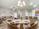 Elegant dining room features a marble table and comfortable seating for four at 548 Coral Trace Blvd, Edgewater, FL 32132