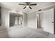 Bedroom with mirrored closet doors, ceiling fan and ensuite bathroom at 5929 Windhover Dr # A02, Orlando, FL 32819