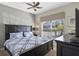 Cozy bedroom with a ceiling fan and dresser at 1574 Slice Way, Davenport, FL 33896