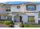 Inviting two-story home with a well-maintained facade, tiled roof, and beautiful front garden at 1574 Slice Way, Davenport, FL 33896