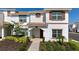 Charming two-story home with a beautifully landscaped front yard and a cozy entrance at 1574 Slice Way, Davenport, FL 33896