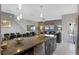 View from kitchen island overlooking dining and living areas at 1574 Slice Way, Davenport, FL 33896