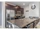 Spacious kitchen island with granite countertops and seating at 1574 Slice Way, Davenport, FL 33896