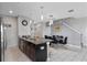 Bright kitchen featuring a granite island with pendant lighting at 1574 Slice Way, Davenport, FL 33896