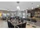 Bright, open-concept living space connecting the kitchen, dining, and living areas, creating a welcoming atmosphere at 1574 Slice Way, Davenport, FL 33896