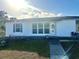 Newly renovated home with a fresh coat of paint and landscaped yard at 1625 Hastings Dr, Deltona, FL 32725