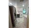 Modern kitchen featuring stainless steel appliances and marble flooring at 1625 Hastings Dr, Deltona, FL 32725
