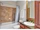 Bathroom with shower/tub combo and granite countertop at 904 Charo Pkwy # 536, Davenport, FL 33897