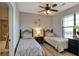 Guest bedroom with two twin beds and large window at 904 Charo Pkwy # 536, Davenport, FL 33897