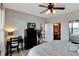 Main bedroom with king bed and access to en-suite bathroom at 904 Charo Pkwy # 536, Davenport, FL 33897