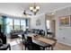 Bright dining area with table and seating for six, offering a view to living room at 904 Charo Pkwy # 536, Davenport, FL 33897