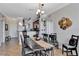 Dining room with dark wood table and seating for six at 904 Charo Pkwy # 536, Davenport, FL 33897