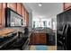 Open kitchen features granite countertops and stainless steel appliances at 904 Charo Pkwy # 536, Davenport, FL 33897