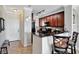 Modern kitchen with dark wood cabinets and granite countertops at 904 Charo Pkwy # 536, Davenport, FL 33897