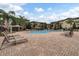 Resort-style pool with lounge chairs at 904 Charo Pkwy # 536, Davenport, FL 33897
