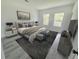 Main bedroom with large windows and modern decor at 2416 Sw 158Th Pl, Ocala, FL 34473