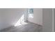 Bright bedroom with gray vinyl flooring and a window at 2416 Sw 158Th Pl, Ocala, FL 34473