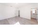 Bright bedroom with wood-look floors and an ensuite bathroom at 2416 Sw 158Th Pl, Ocala, FL 34473
