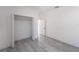 Bedroom with gray vinyl flooring and a spacious closet at 2416 Sw 158Th Pl, Ocala, FL 34473