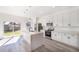 Modern kitchen with white cabinets and large island at 2416 Sw 158Th Pl, Ocala, FL 34473