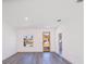Spacious living room with hardwood floors and large window at 2416 Sw 158Th Pl, Ocala, FL 34473