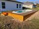 New home with inviting, elevated wooden pool deck and spa at 2416 Sw 158Th Pl, Ocala, FL 34473