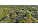 Aerial view of a charming house nestled among lush trees and other homes at 400 Raehn St, Orlando, FL 32806