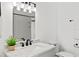Clean bathroom with white subway tile, marble vanity, and updated fixtures at 400 Raehn St, Orlando, FL 32806