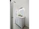 Modern bathroom with gray vanity, hexagon tile floors, and updated fixtures at 400 Raehn St, Orlando, FL 32806