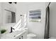 Updated bathroom with white subway tiles and modern vanity at 400 Raehn St, Orlando, FL 32806