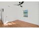 Bright bedroom featuring hardwood floors and a ceiling fan at 400 Raehn St, Orlando, FL 32806