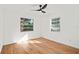 Well-lit bedroom with hardwood floors and two windows at 400 Raehn St, Orlando, FL 32806