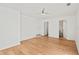 Light and airy bedroom with hardwood floors and ensuite bathroom access at 400 Raehn St, Orlando, FL 32806