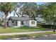 Charming bungalow with a newly painted exterior and landscaped lawn at 400 Raehn St, Orlando, FL 32806