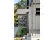 Home exterior featuring a stone accent wall and lush landscaping at 400 Raehn St, Orlando, FL 32806