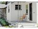 Quaint front porch with a wicker chair, perfect for relaxing at 400 Raehn St, Orlando, FL 32806