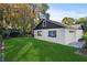 White house exterior with a dark brown roof and attached garage at 400 Raehn St, Orlando, FL 32806