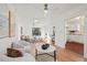 Open concept living room, hardwood floors, and updated kitchen at 400 Raehn St, Orlando, FL 32806