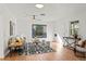 Living room featuring hardwood floors, a neutral color palette, and plenty of natural light at 400 Raehn St, Orlando, FL 32806