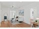Spacious living room with hardwood floors, a cozy sitting area, and natural light at 400 Raehn St, Orlando, FL 32806