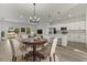 Bright open-concept living room and kitchen with modern finishes, breakfast bar, and dining area at 4479 Sw 170Th Rd, Ocala, FL 34473