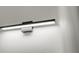 Sleek, modern bathroom light fixture mounted on a textured white wall, providing a soft glow at 4513 Sw 170Th Rd, Ocala, FL 34473