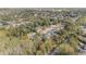 Aerial view of a residential neighborhood showcasing houses nestled amongst lush greenery at 6689 Bell Glade Pl, Sanford, FL 32771