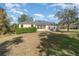 House with backyard, green hedge, and grass at 6689 Bell Glade Pl, Sanford, FL 32771