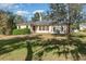 House with backyard, green hedge, and grass at 6689 Bell Glade Pl, Sanford, FL 32771