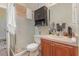 Clean bathroom with shower and wooden vanity at 6689 Bell Glade Pl, Sanford, FL 32771