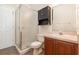 Functional bathroom with a glass-enclosed shower, single vanity, and tile flooring at 6689 Bell Glade Pl, Sanford, FL 32771