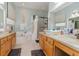 Elegant bathroom with dual vanities, soaking tub, and walk-in shower at 6689 Bell Glade Pl, Sanford, FL 32771